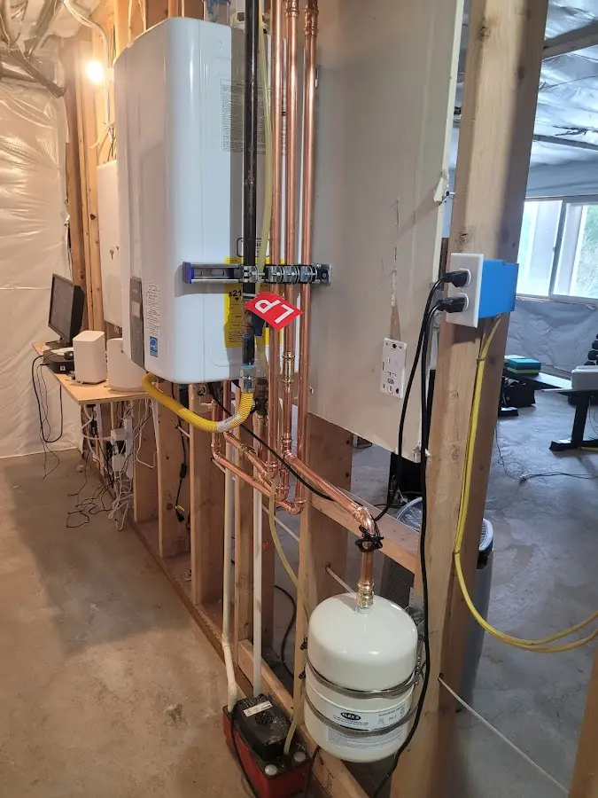 Licensed plumber repairing a kitchen sink in Auburn